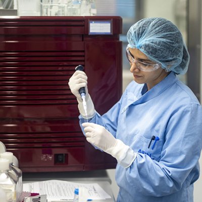 A vaccine researcher works in a labortory